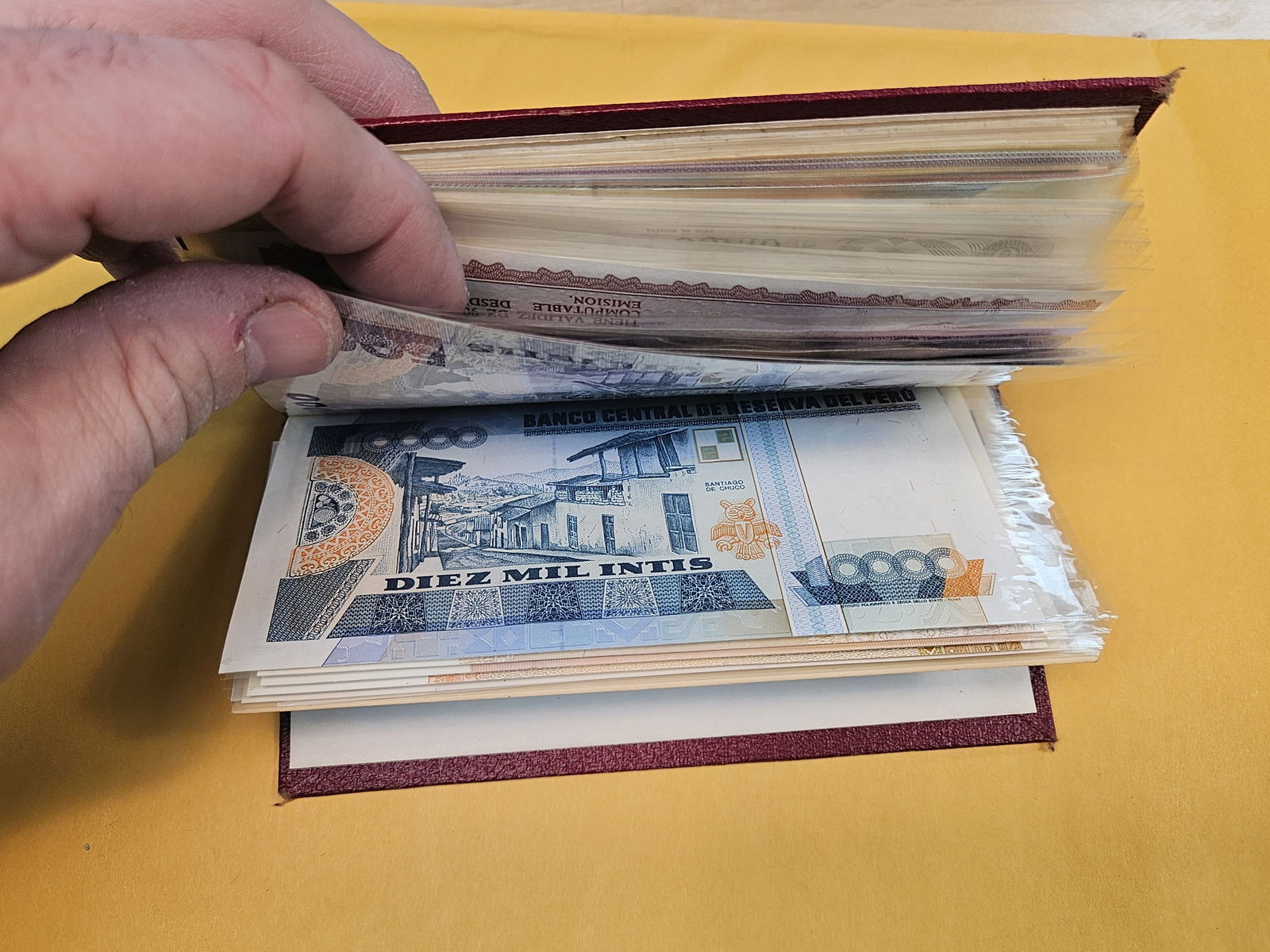 Full little booklet of mixed World currency - 15