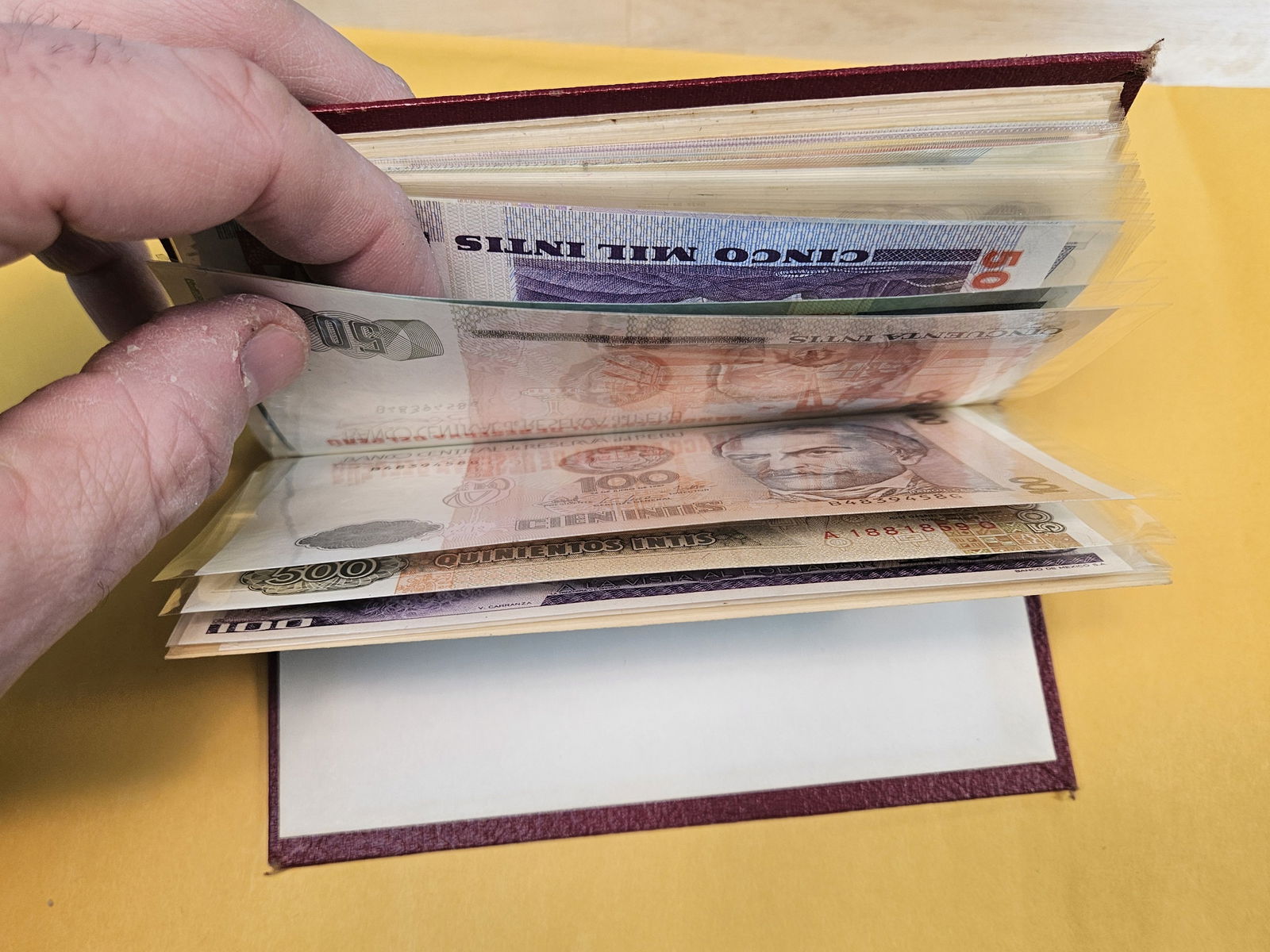 Full little booklet of mixed World currency - 16