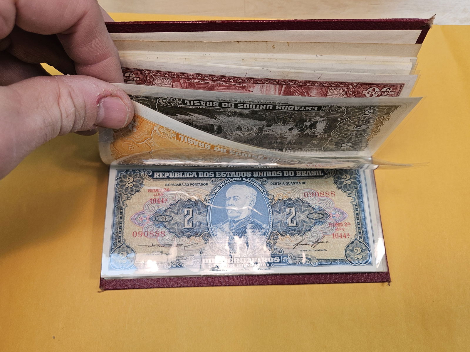 Full little booklet of mixed World currency - 7