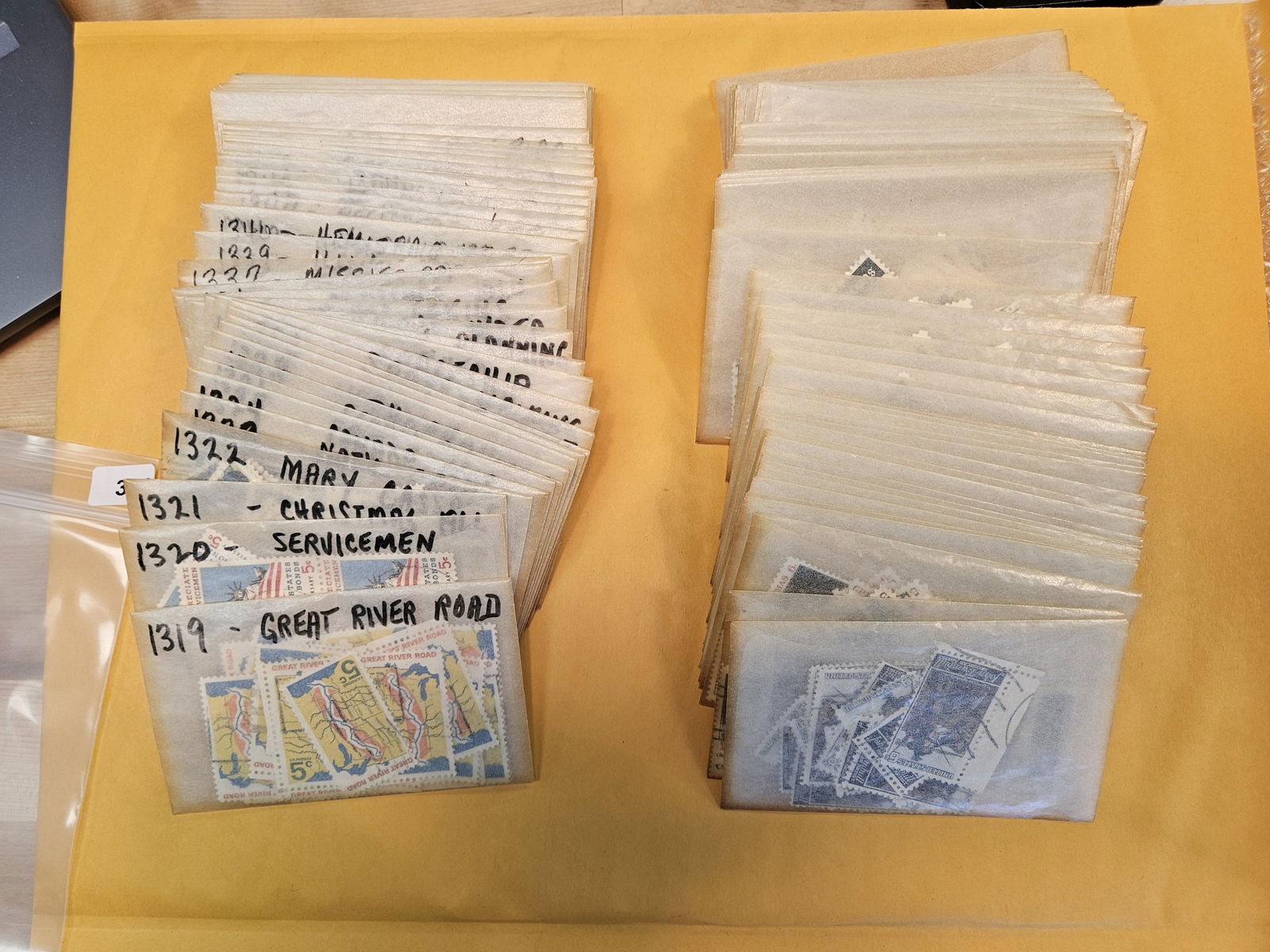 PHILATELICS!: About 50 wax envelopes with mixed Stamps. I think they're all cancelled, but we didn't check 