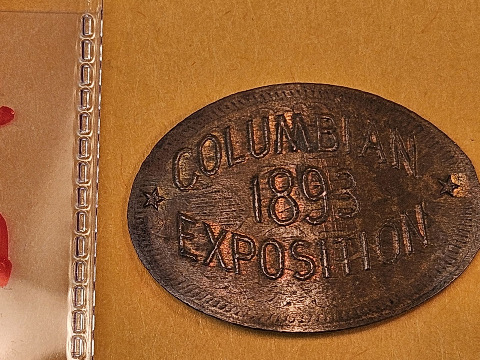 1893 Uncirculated Columbian Exposition Elongated Cent: On a 1893 Indian Cent 