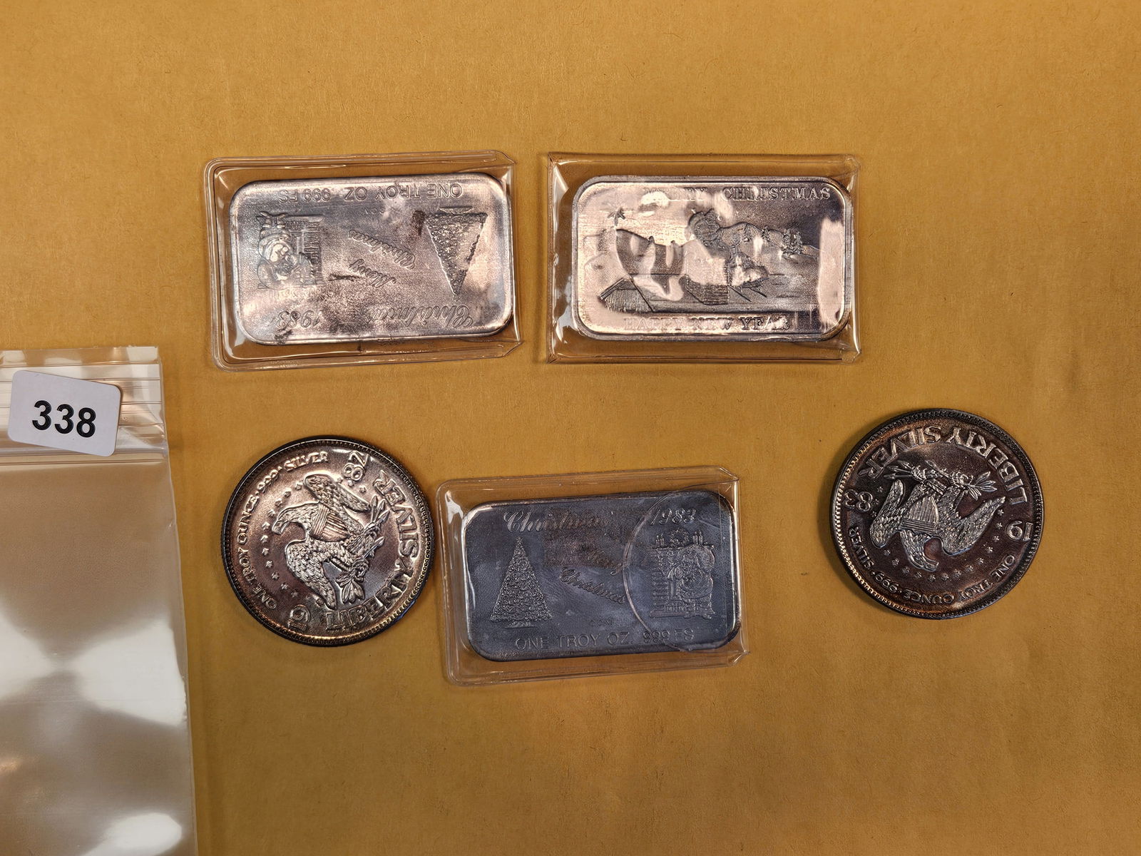 Five mixed 1-Troy ounce .999 fine silver pieces: bars and round 