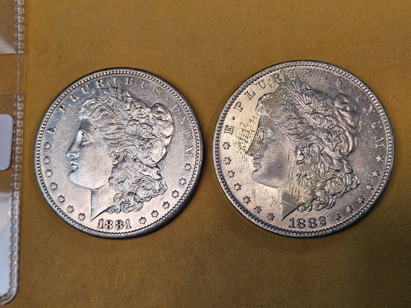 Two Bright About Uncirculated Morgan silver Dollars: 1881-S and 1882-O