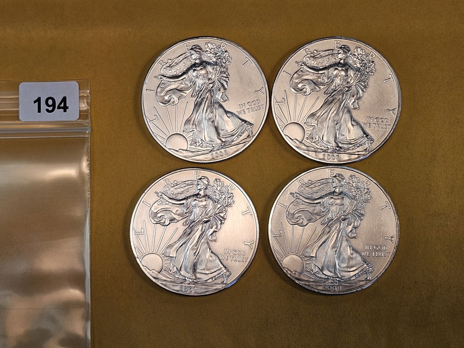 Four 2008 American Silver Eagles: Light issues