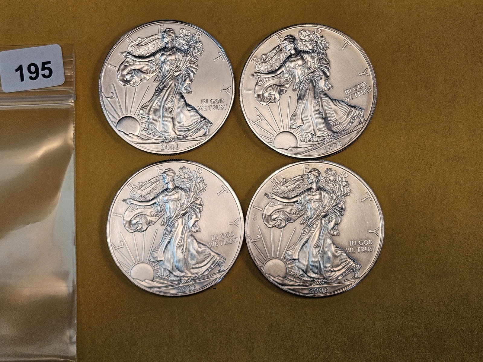 Four 2008 American Silver Eagles: Light issues