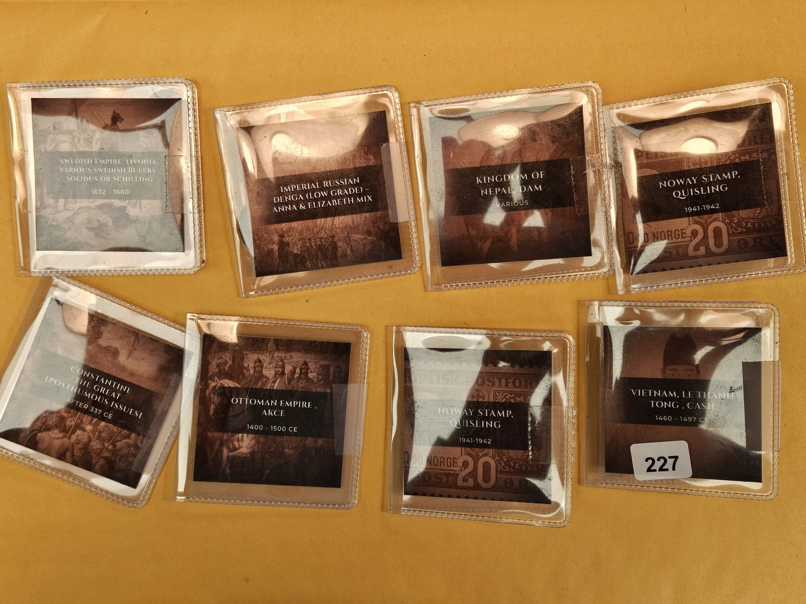 Eight fun, mixed, World coins and stamps: All in holders 