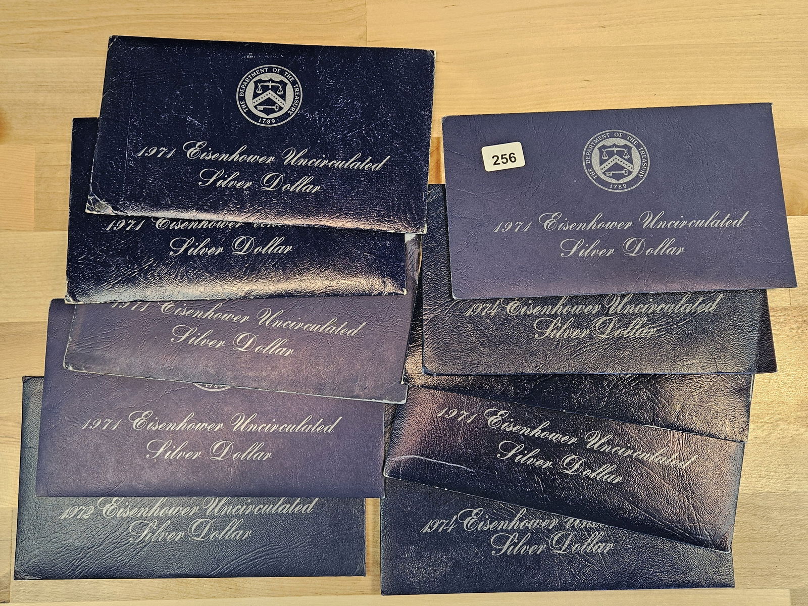 Ten GEM Brilliant Uncirculated SILVER Eisenhower Dollars: Blue Ikes. All in GSA flat packs.
