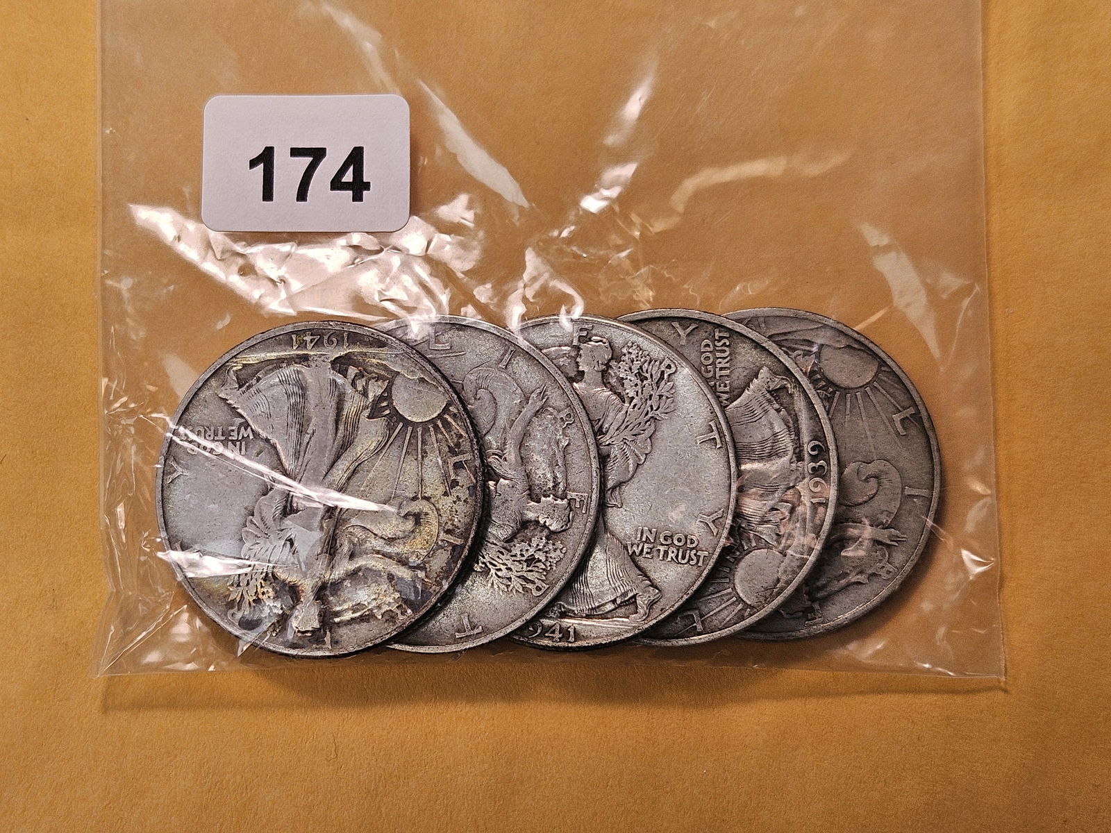 Five Circulated Walking Liberty Silver Half Dollars: Mixed dates, from consigner and unchecked by us