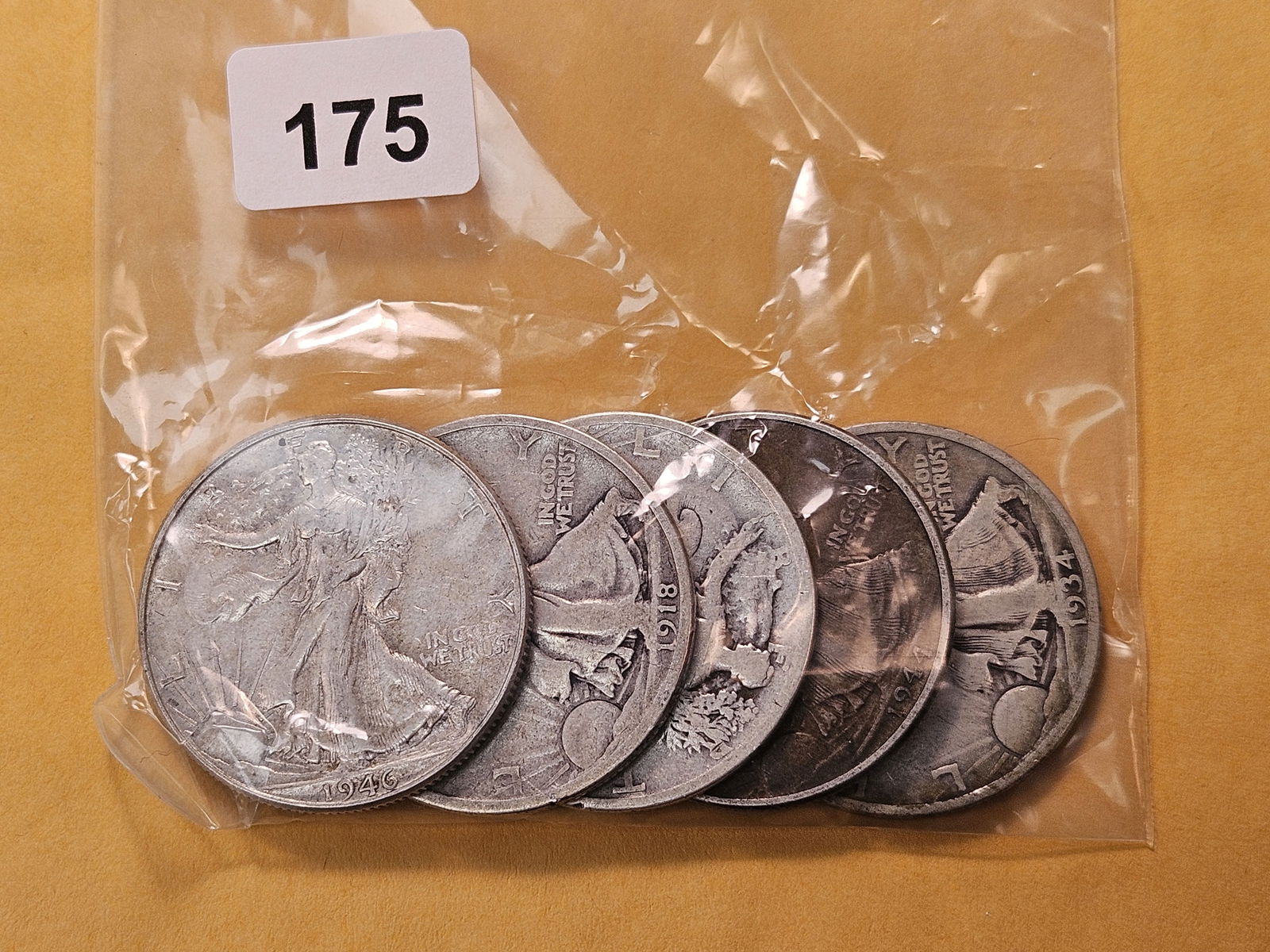 Five Circulated Walking Liberty Silver Half Dollars: Mixed dates, from consigner and unchecked by us
