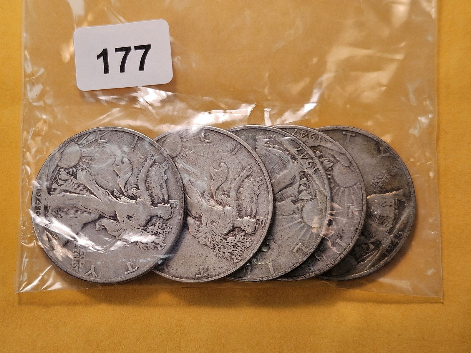 Five Circulated Walking Liberty Silver Half Dollars: Mixed dates, from consigner and unchecked by us