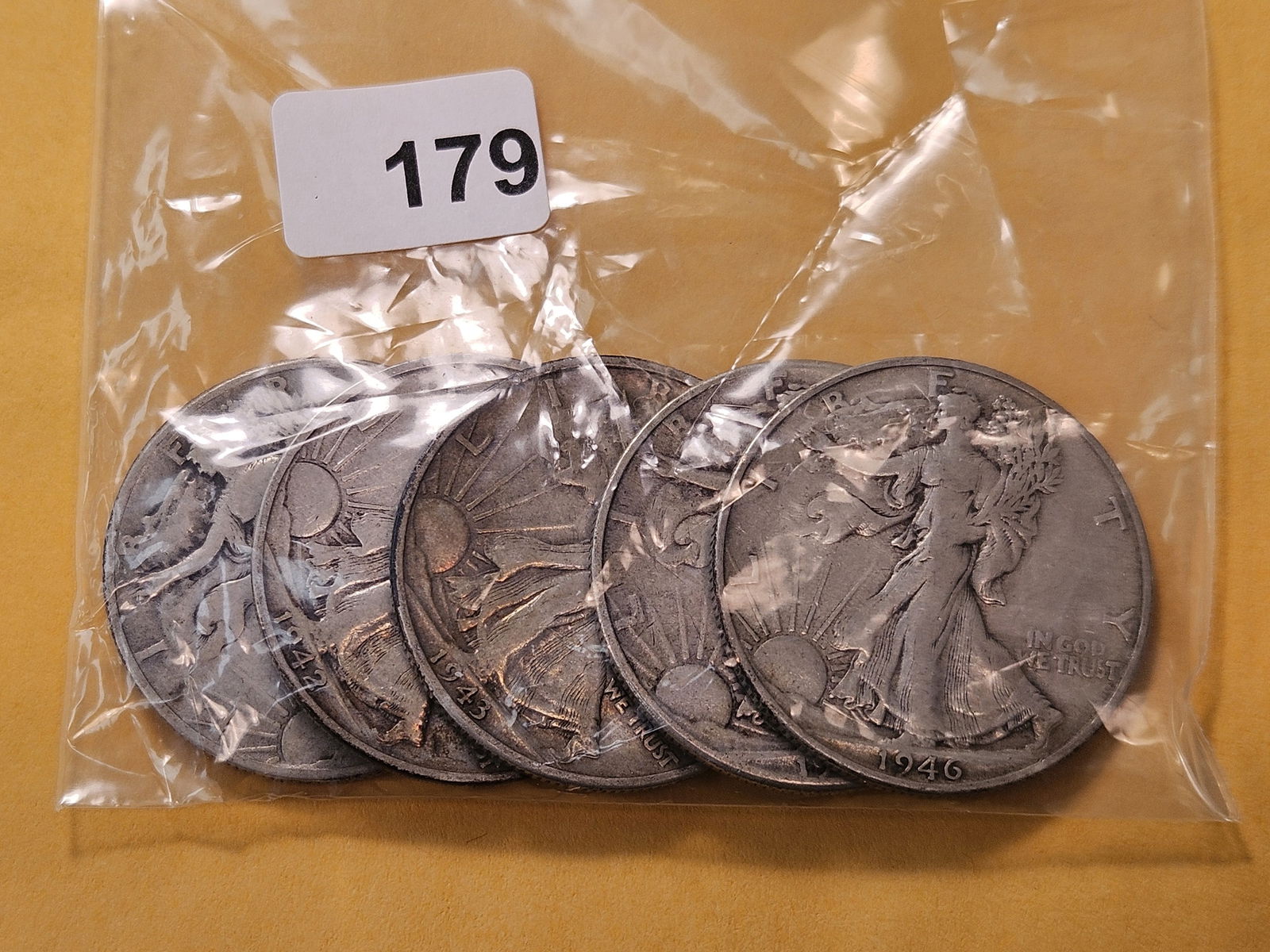 Five Circulated Walking Liberty Silver Half Dollars: Mixed dates, from consigner and unchecked by us