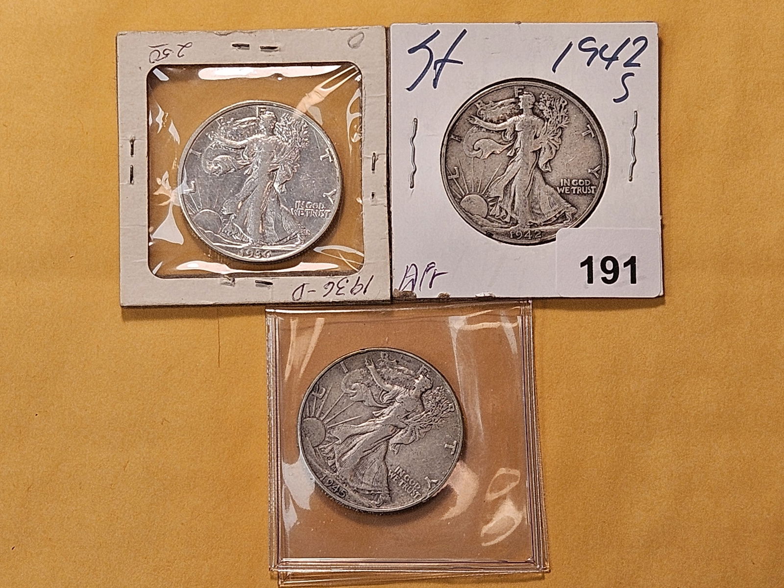 Three Circulated Walking Liberty Silver Half Dollars: 1936-D, 1942-S and 1945 