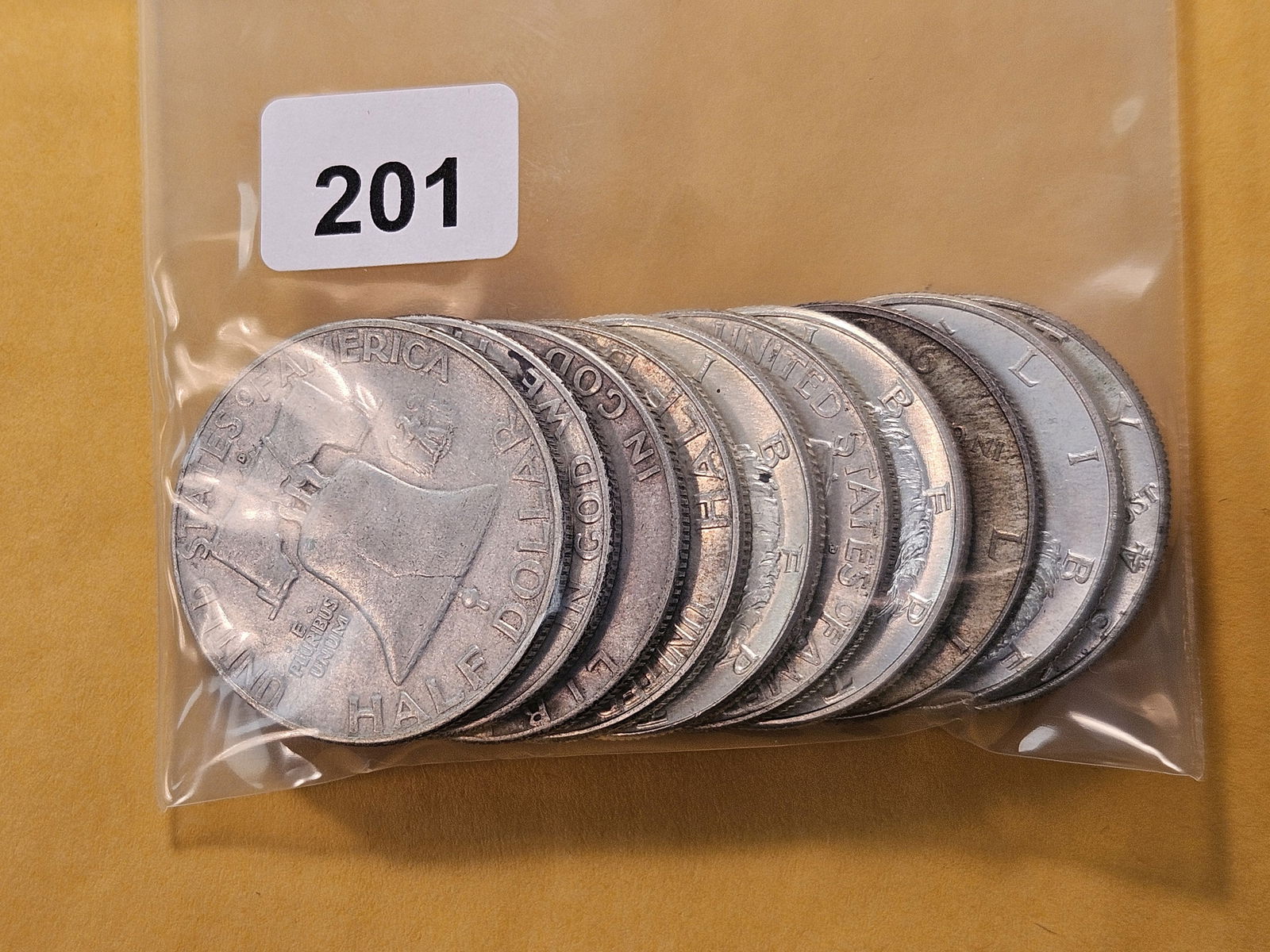 Ten Circulated US Silver Half Dollars: Five Kennedy's and five Franklin's 