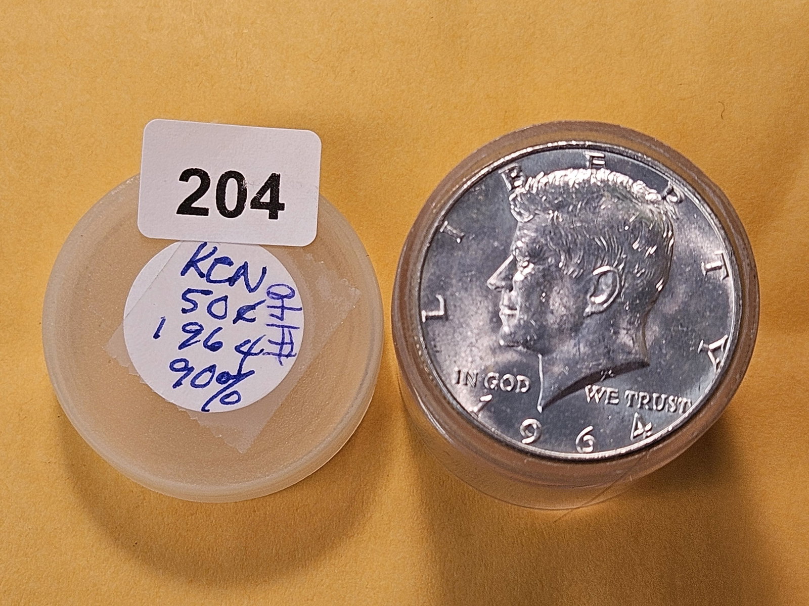 Roll of Twenty 1964 Kennedy Silver Half Dollars: About Uncirculated to Brilliant Uncirculated. From consigner and unchecked by us 