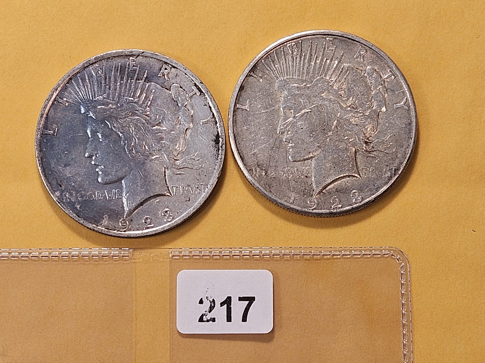 Two Circulated Peace Silver Dollars: 1923 and 1923-S