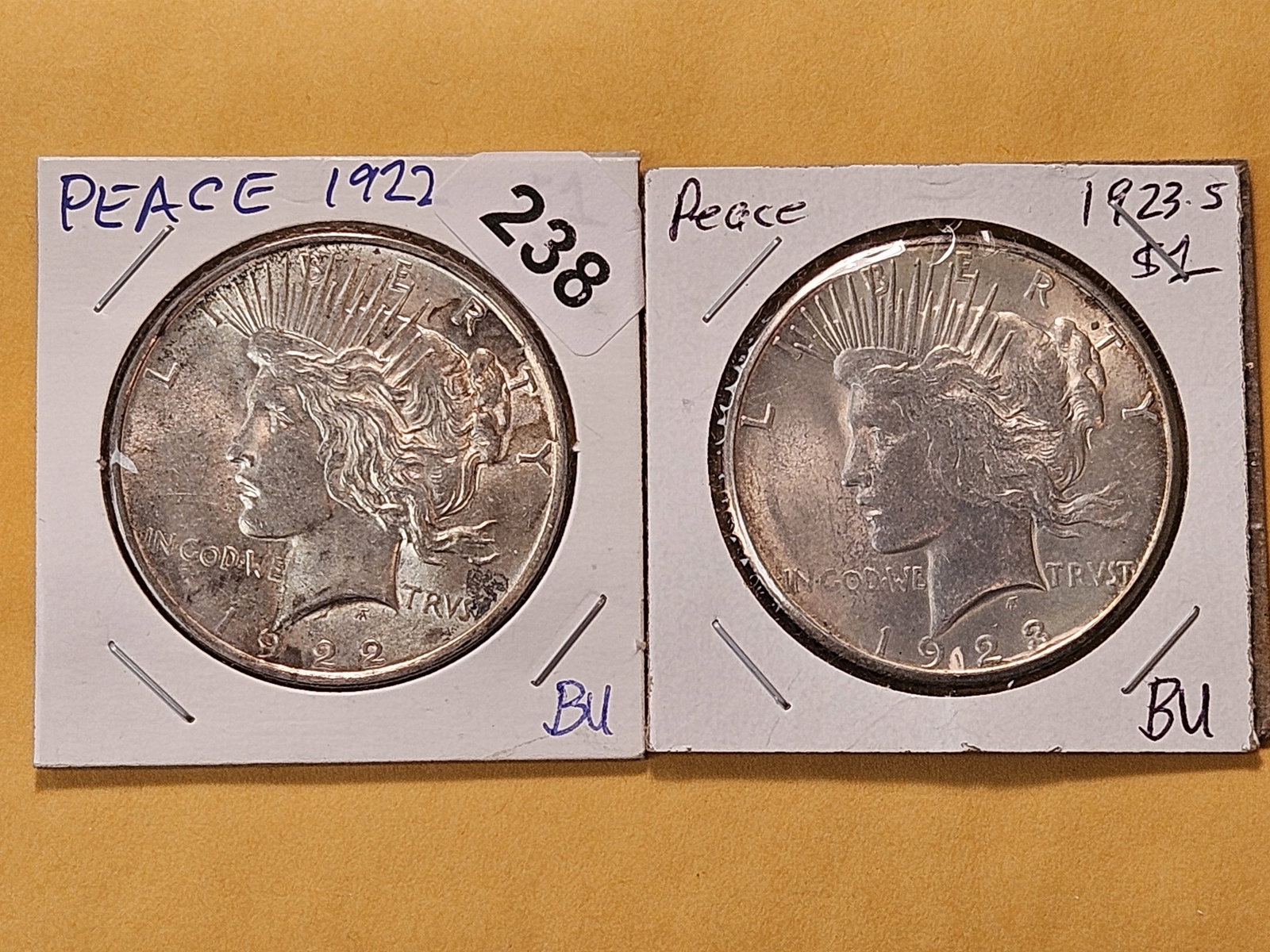 Two Brilliant About Uncirculated Peace Silver Dollars: 1922 and 1923-S 