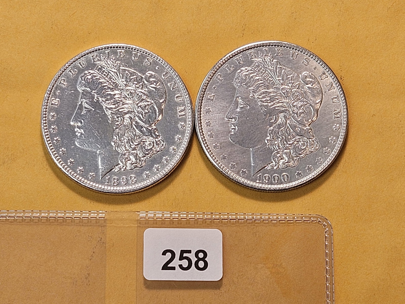 Two About Uncirculated Morgan Silver Dollars: 1898 and 1900 