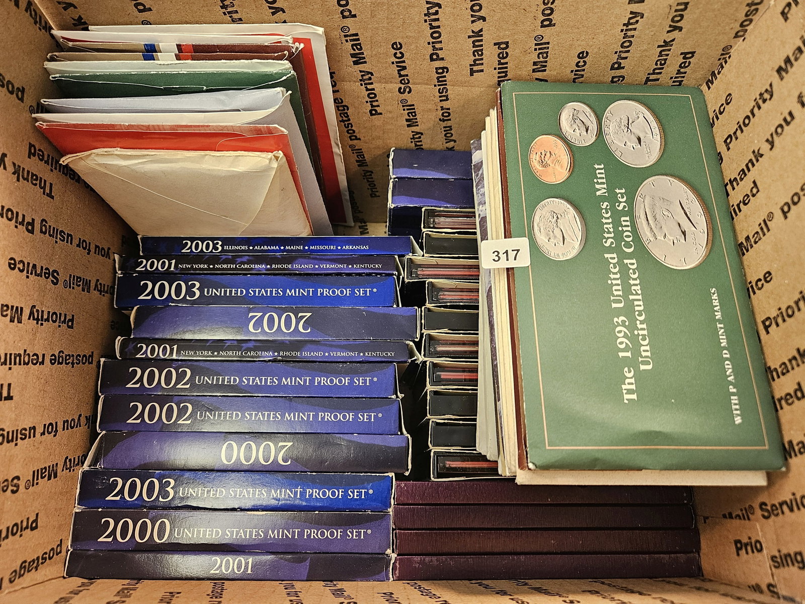 Fifty Mixed US Proof and Uncirculated Coin Sets: Mixed dates 1970's to 2008. Ships separately in Flat Rate Medium Box 