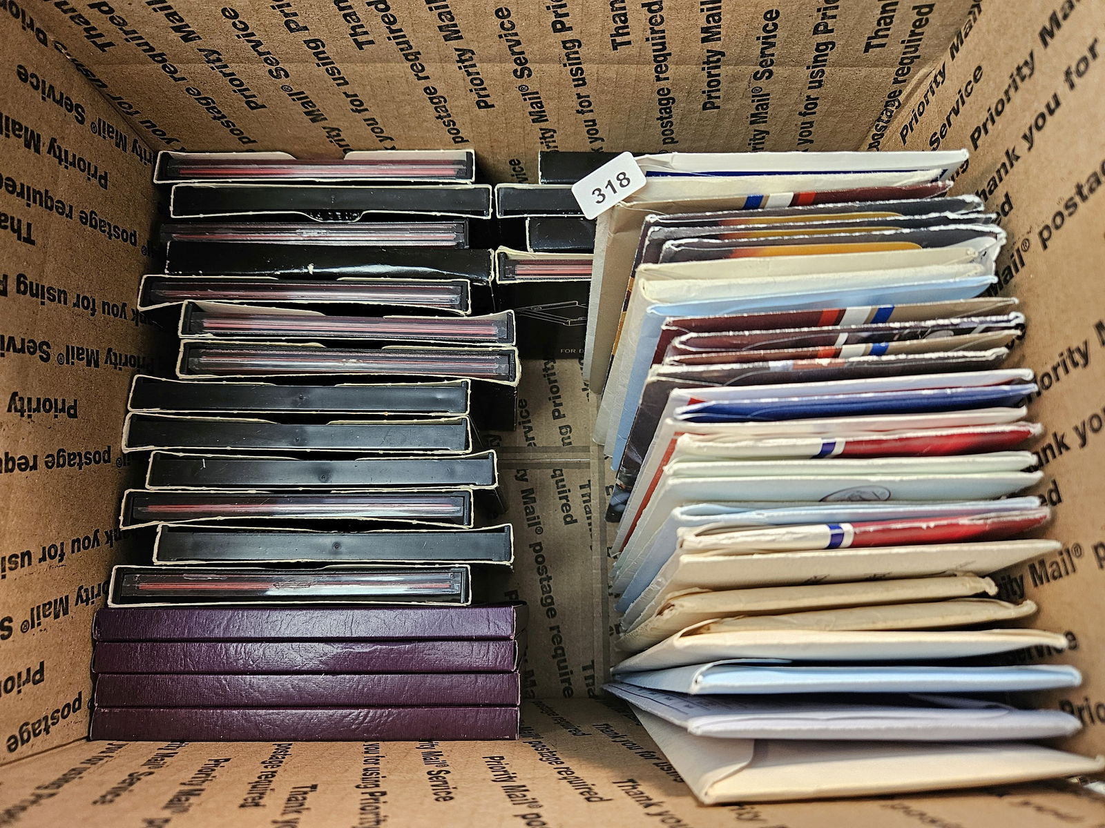 Fifty Mixed US Proof and Uncirculated Coin Sets: Mixed dates 1970's to 2008. Ships separately in Flat Rate Medium Box 