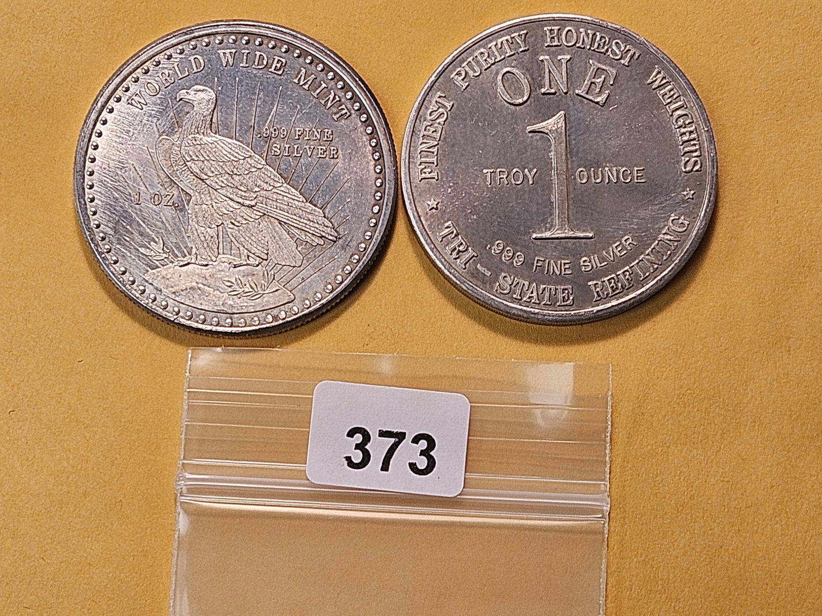 Two One Troy Ounce .999 Fine Silver Rounds: One from Tri-State Refining and one from World Wide Mint 