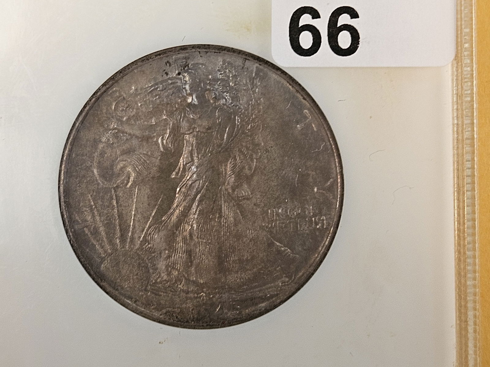 NGC 1945 Walking Liberty half Dollar in Mint State 64: Old, fatty holder! Strong toning 