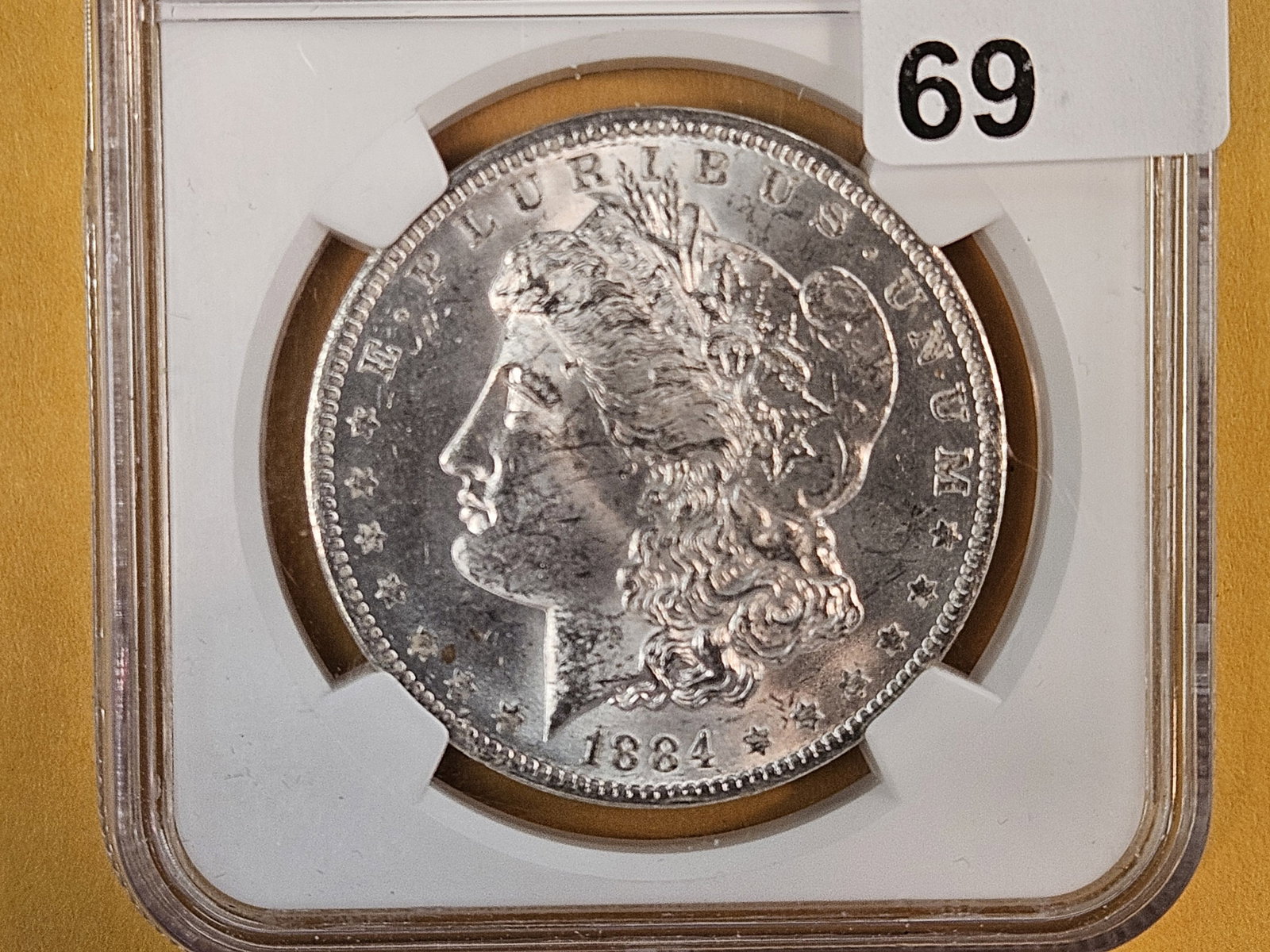 NGC 1884-O Morgan Dollar in Brilliant Uncirculated: Well….i guess it's just too tough to grade, eh?