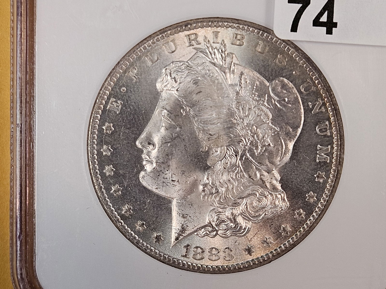 ** KEY DATE ** NGC 1883-CC Morgan Dollar in Mint State 64: KEY DATE! CARSON CITY! Outstanding original luster and toning! Very clean fields. Near Gem! 