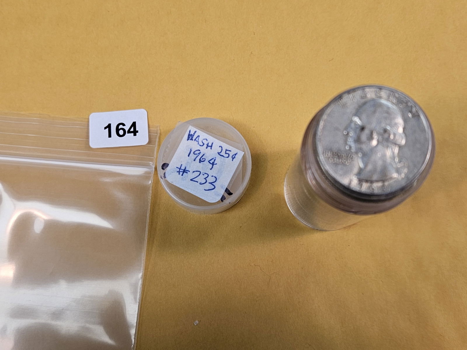 Full Roll of silver Washington Quarters: From Consignor. Unchecked by us. Top says 1964. probably all circulated 