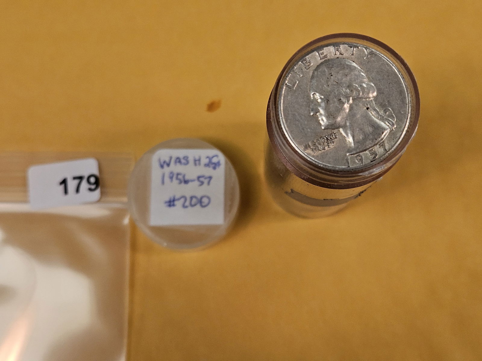 Full Roll of silver Washington Quarters: From Consignor. Unchecked by us. Top says 1956 - 57. Probably all circulated