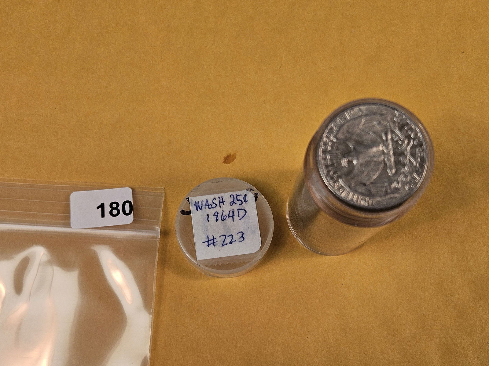 Full Roll of silver Washington Quarters: From Consignor. Unchecked by us. Top says 1964-D. Probably all circulated 