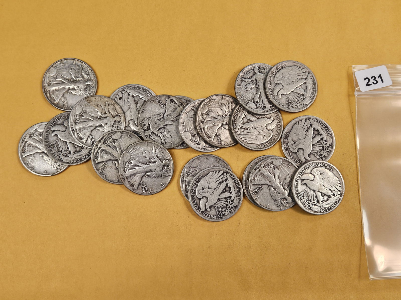 Twenty mixed silver Walking Liberty half dollars: Circulated 