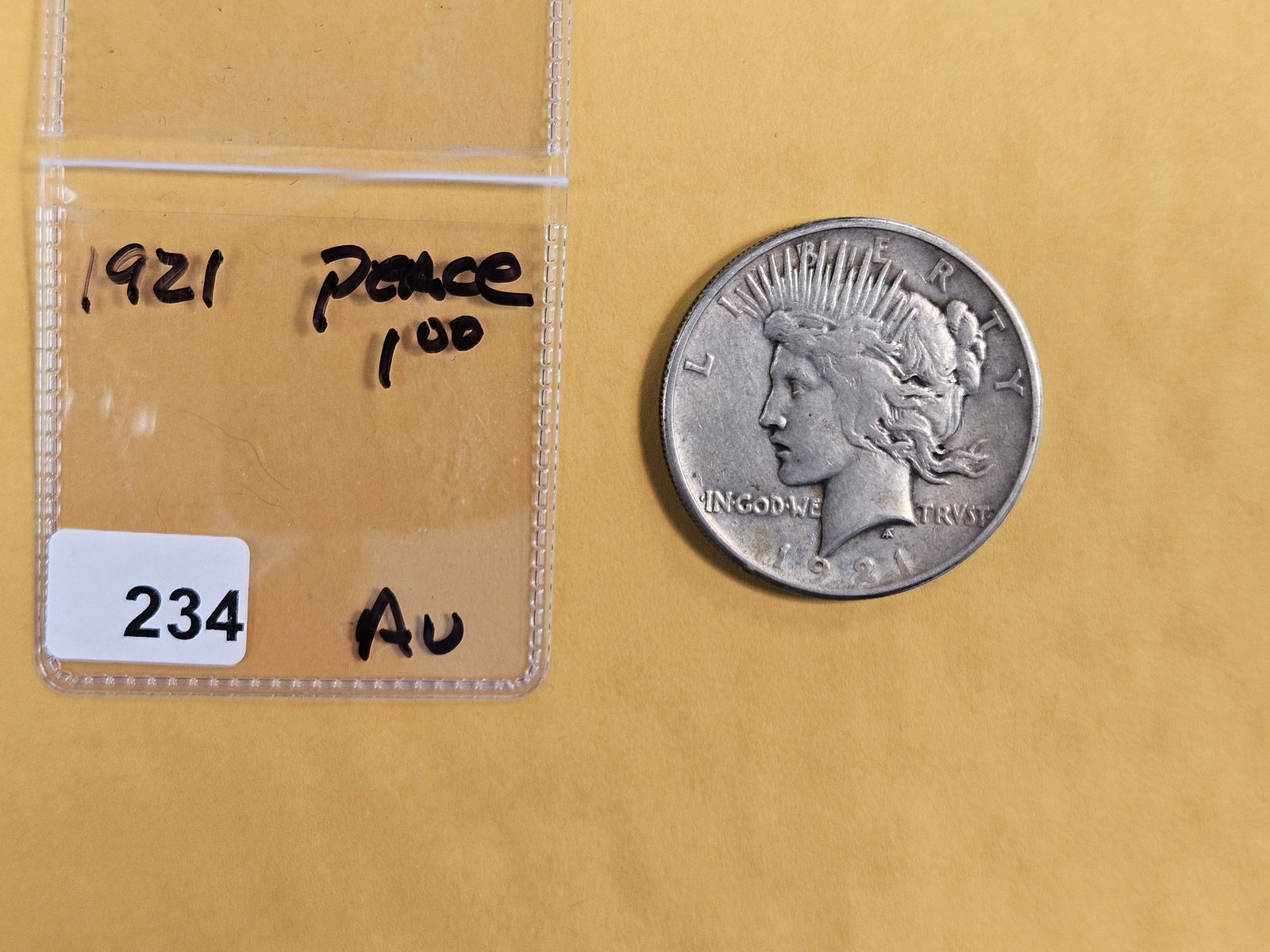 ** KEY DATE ** 1921 Peace silver dollar in About Uncirculated - 2