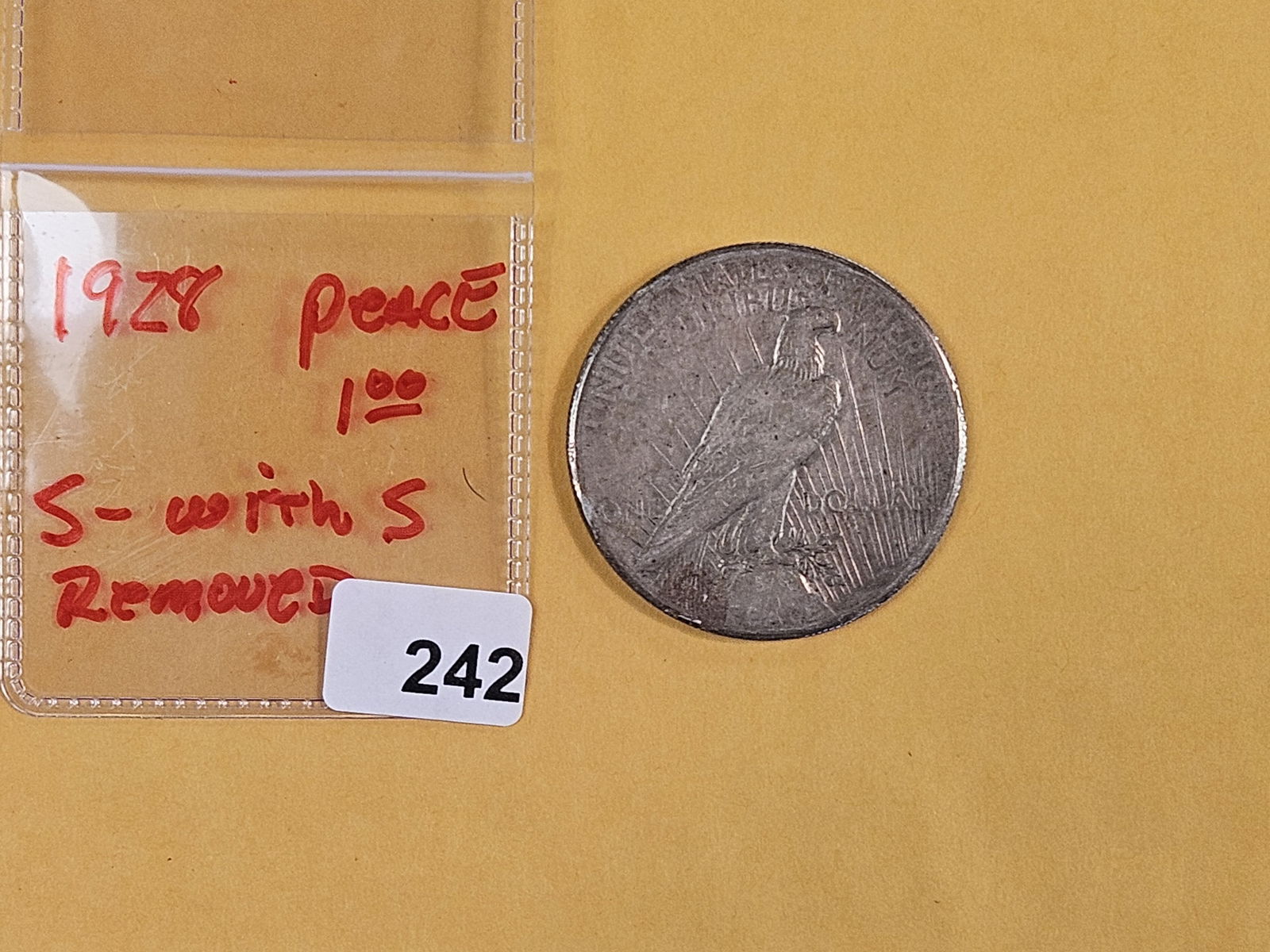 1928-S (with S Removed) Peace dollar: Yes…someone tried to pass this off as a real 1928. The dealer bought it and just wants to get rid of it. Worth its weight in silver 