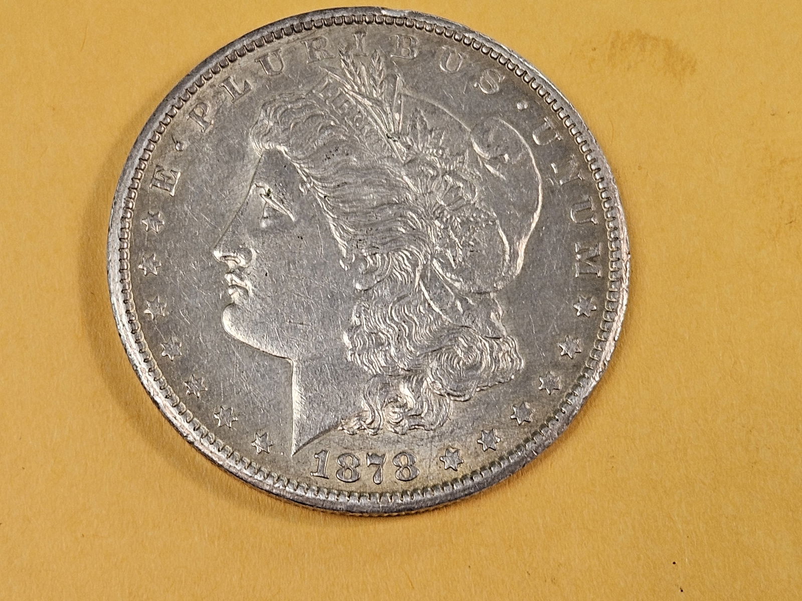 ** KEY DATE ** 1878-CC Morgan Dollar in About Uncirculated - 3