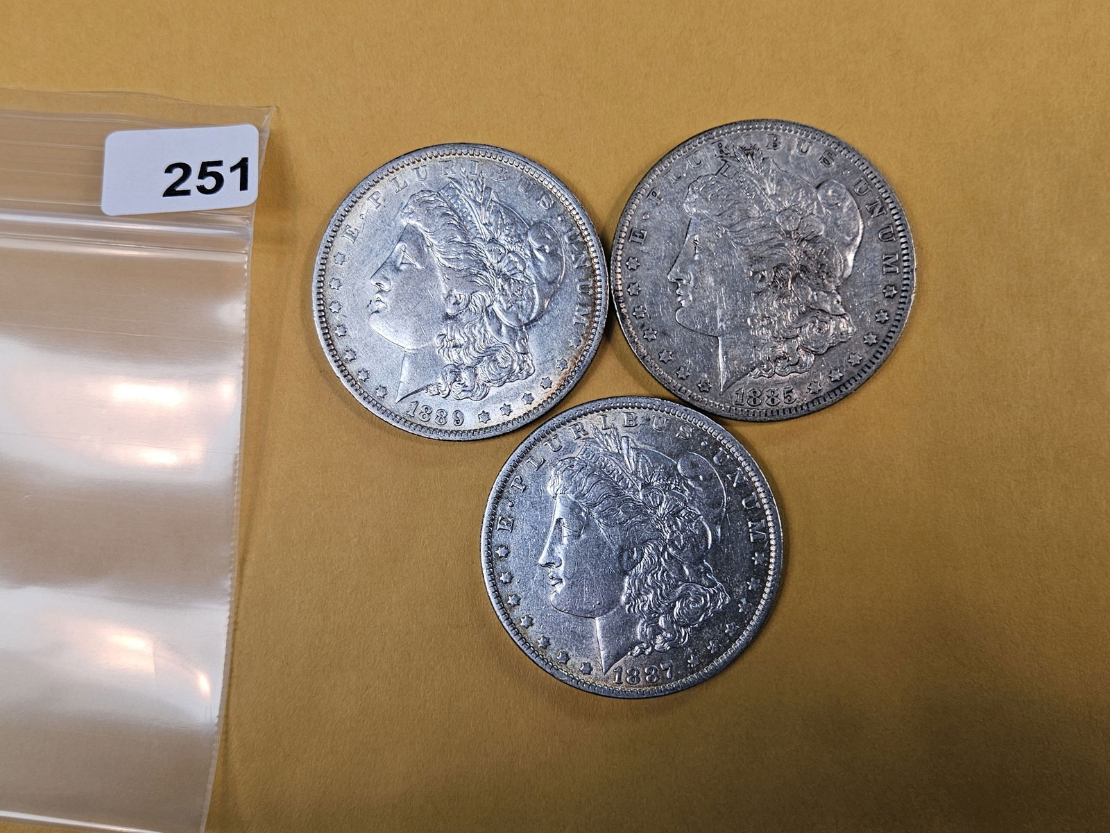 Three Morgan Silver Dollars: All in XF to AU condition 