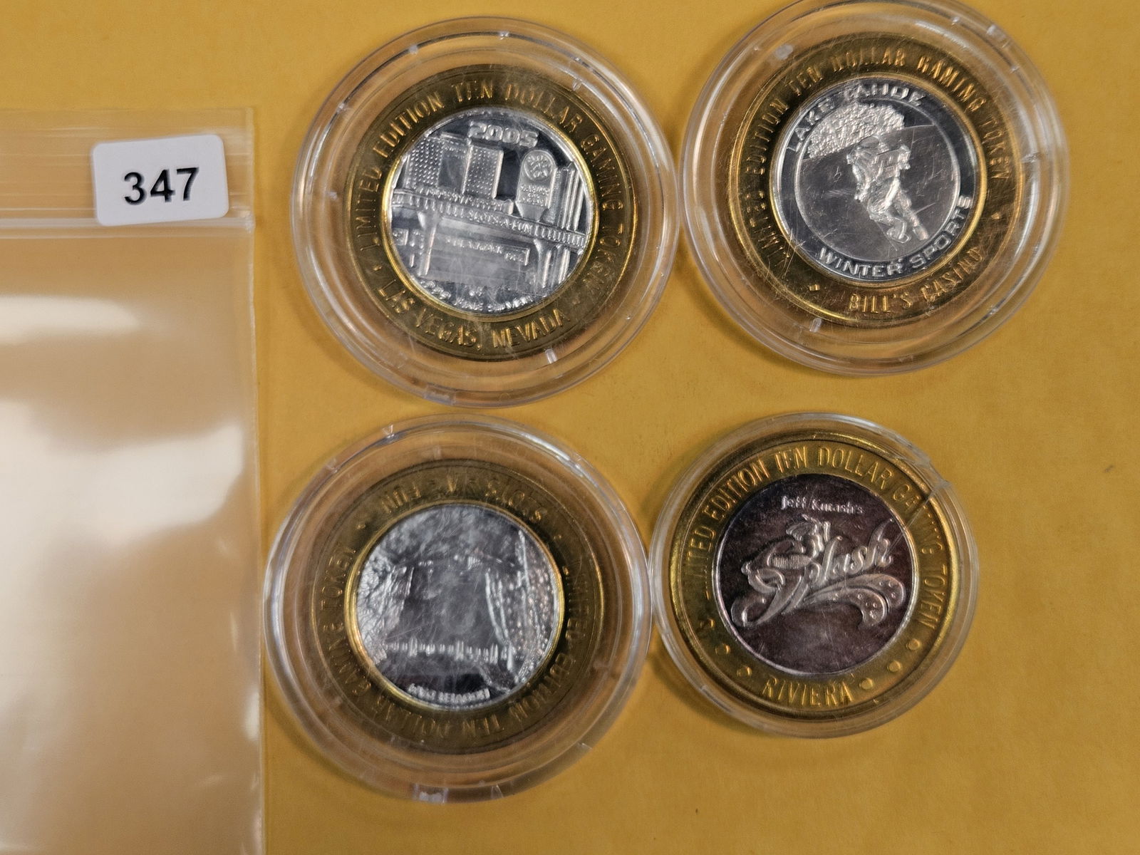 Four mixed GEM .999 fine silver center Casino Gaming Tokens: mixed. In plastic capsules 