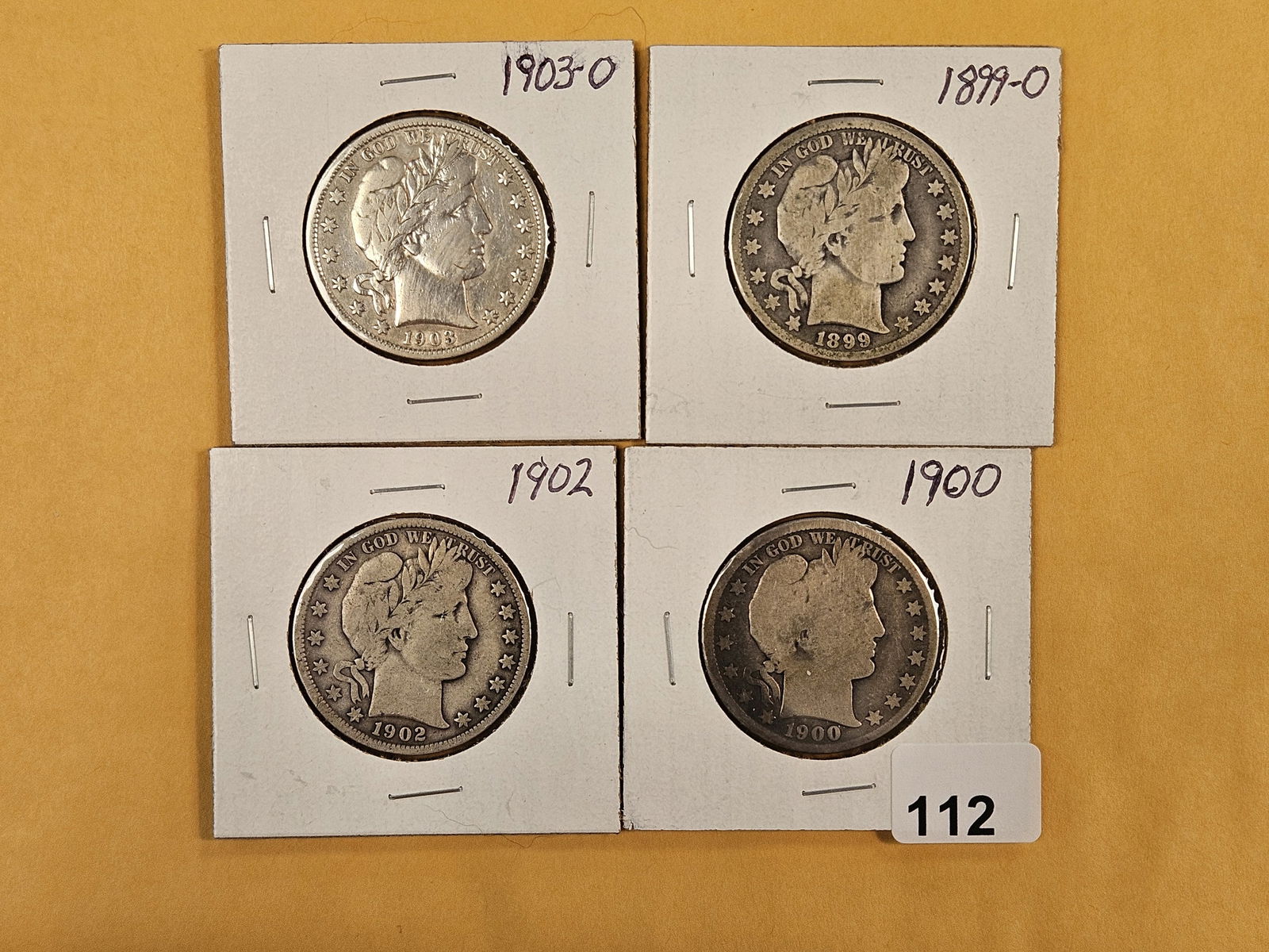 Four mixed silver Barber Half Dollars (1 of 3)