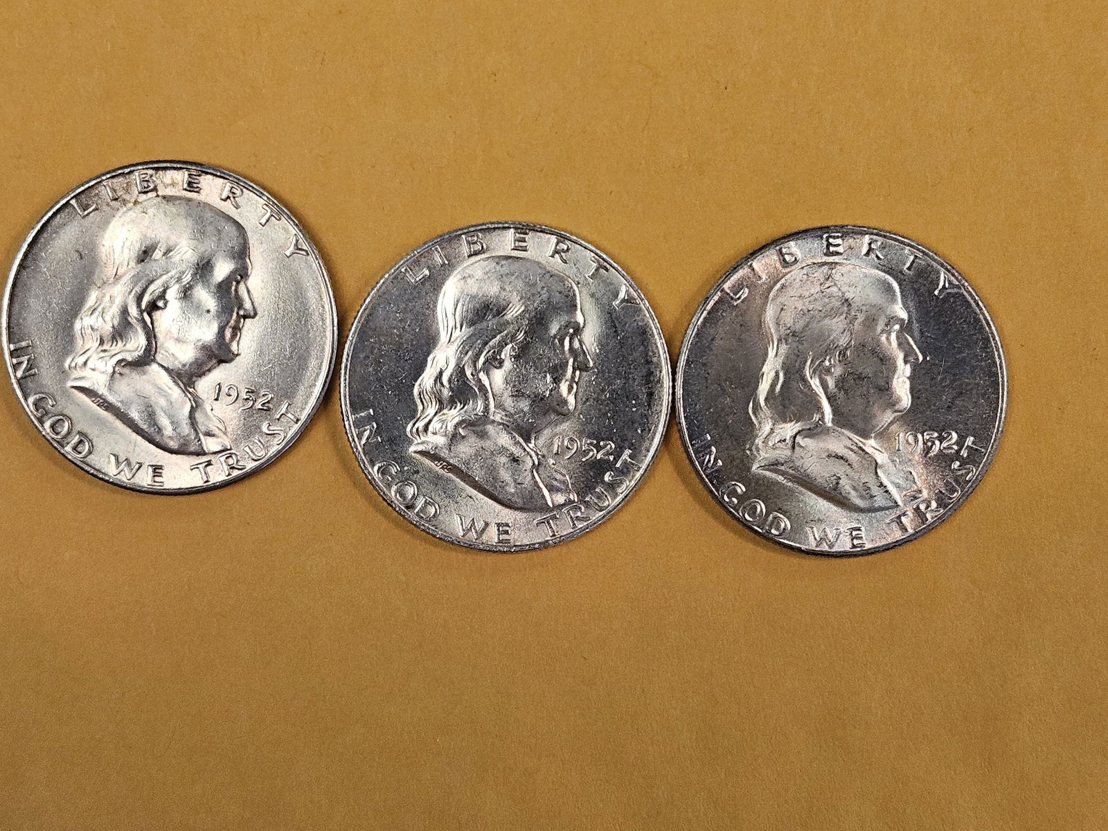 Three Choice Brilliant Uncirculated silver Franklin Half Dollars: 1952 P-D-S
