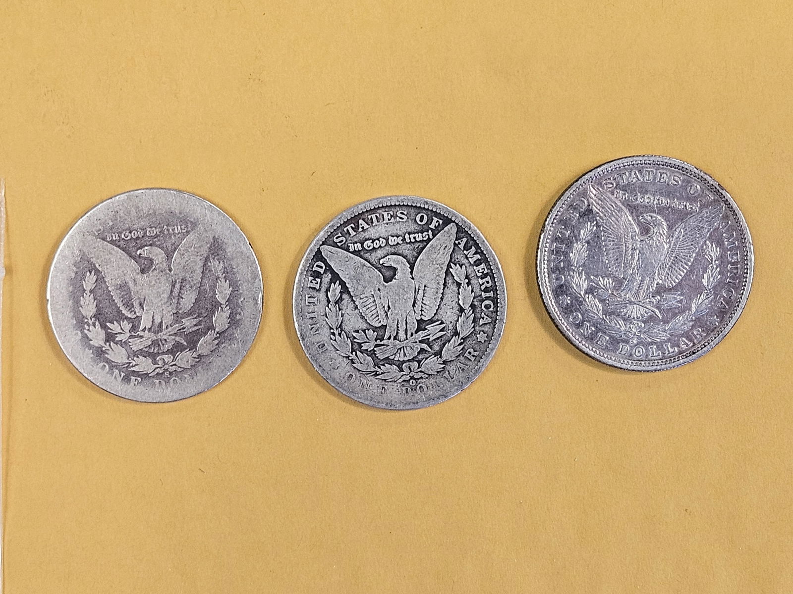 Three mixed Morgan Silver Dollars - 2
