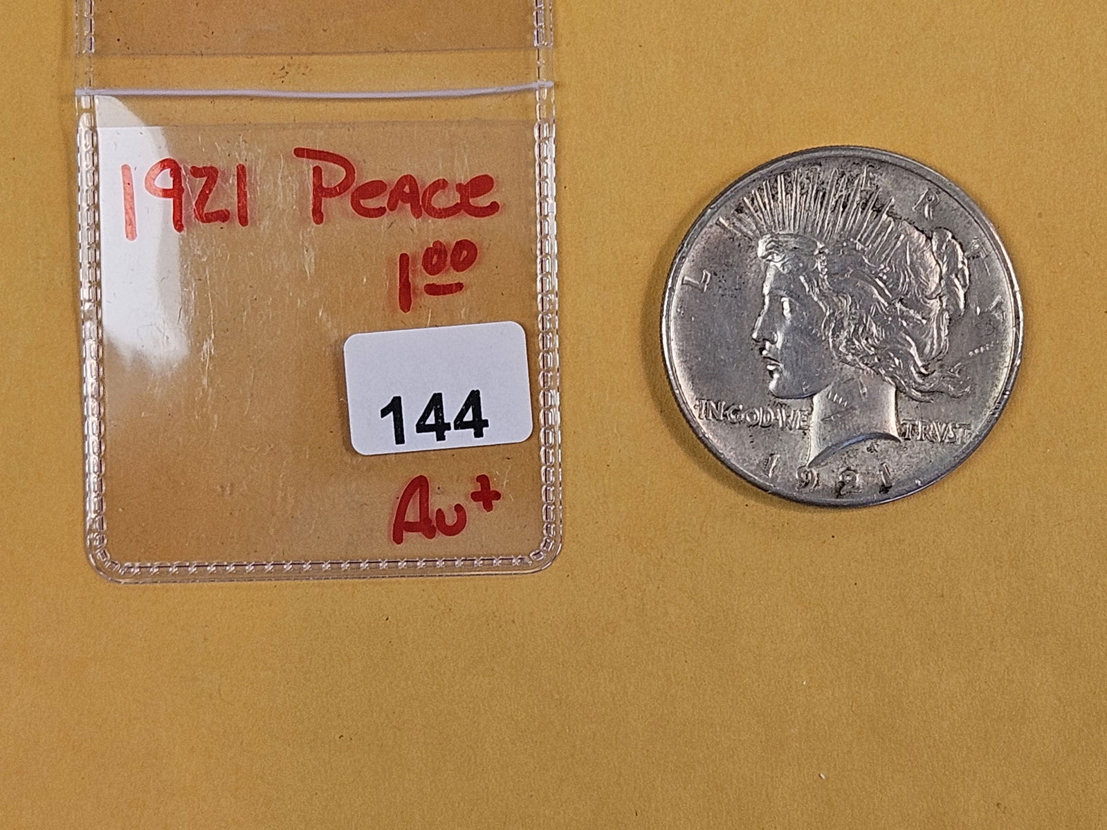 ** KEY DATE ** 1921 Peace silver Dollar in About Uncirculated plus - 2