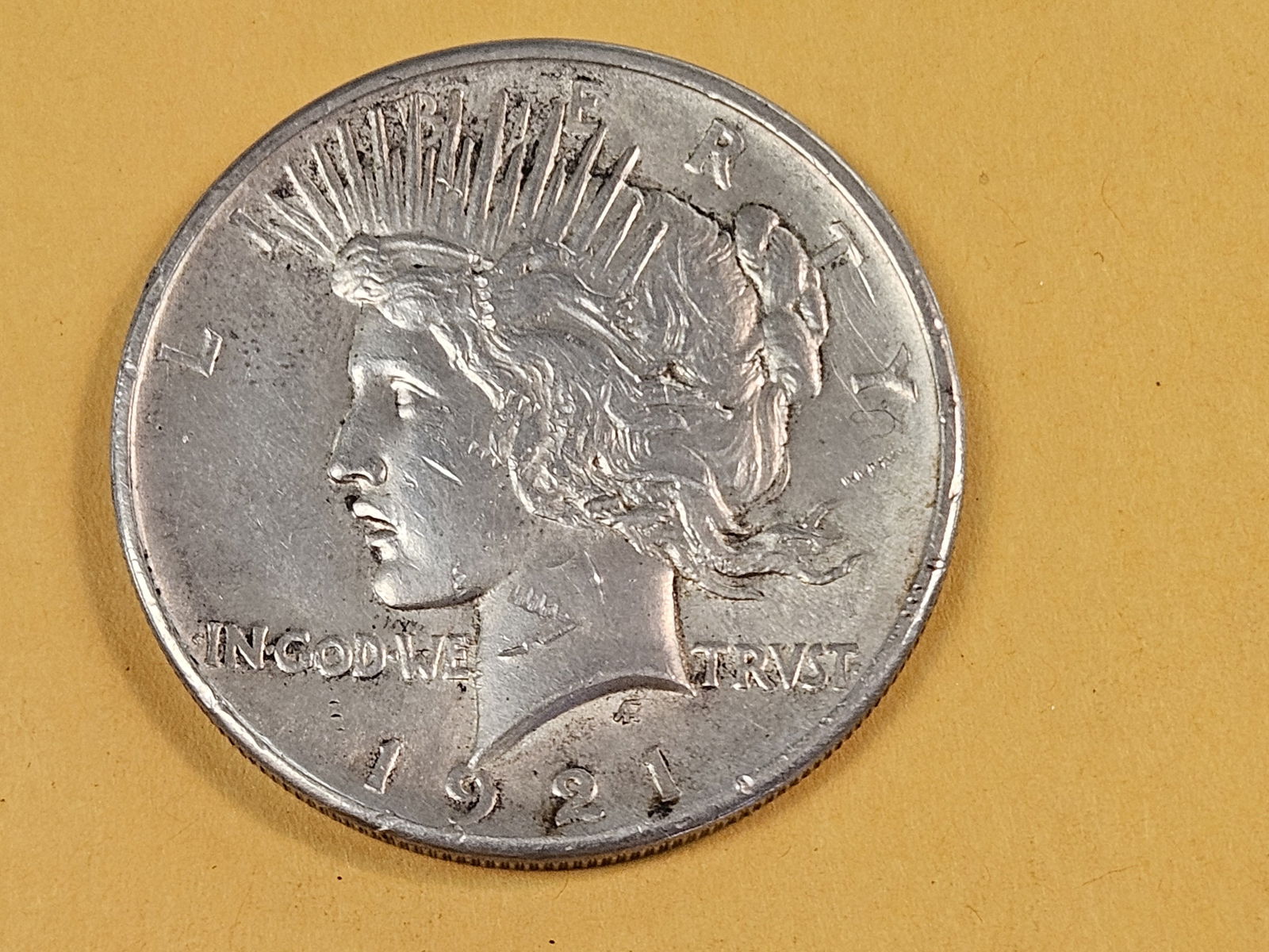** KEY DATE ** 1921 Peace silver Dollar in About Uncirculated plus - 3