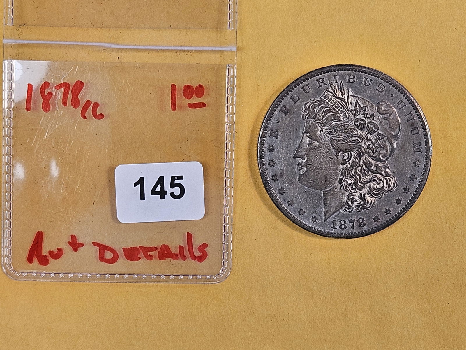 ** KEY DATE ** 1878-CC Morgan Dollar in About Uncirculated plus - details - 2