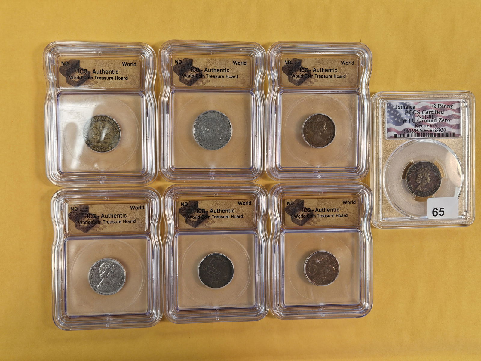 Seven mixed PCGS and ICG-graded World coins: One is from Ground Zero World Trade Center Recovery coin 