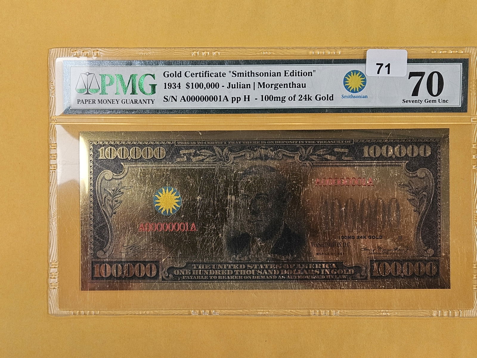 PERFECT! PMG 1934 $100,000 Gold Certificate replica in GEM Uncirculated 70: Serial Number 1. Has 100mg of 24 karat gold 