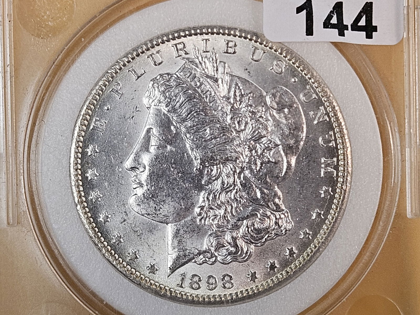 Brilliant 1898-O Morgan Silver Dollar: Says MS-66, but I'm thinking more AU-58 to MS-62 range 
