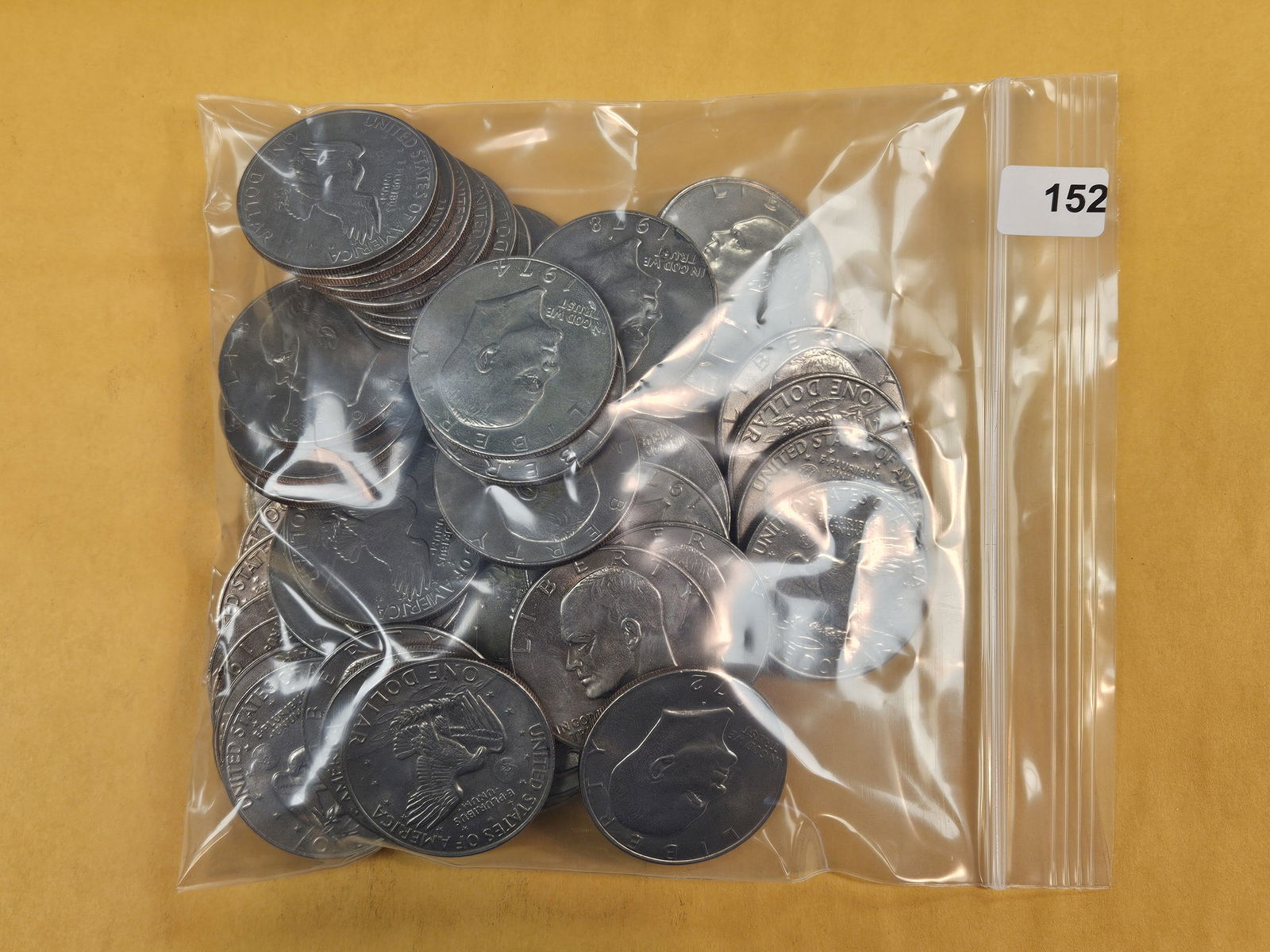 Fifty Eisenhower Dollars: Mixed. Unchecked by us. Circulated 