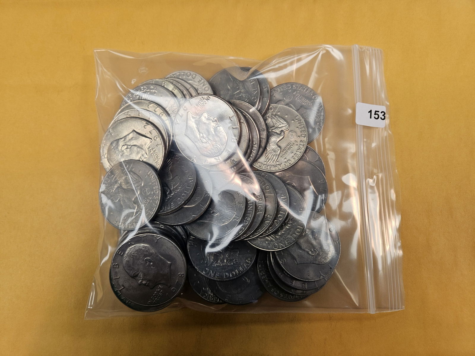 Fifty Eisenhower Dollars: Mixed. Unchecked by us. Circulated