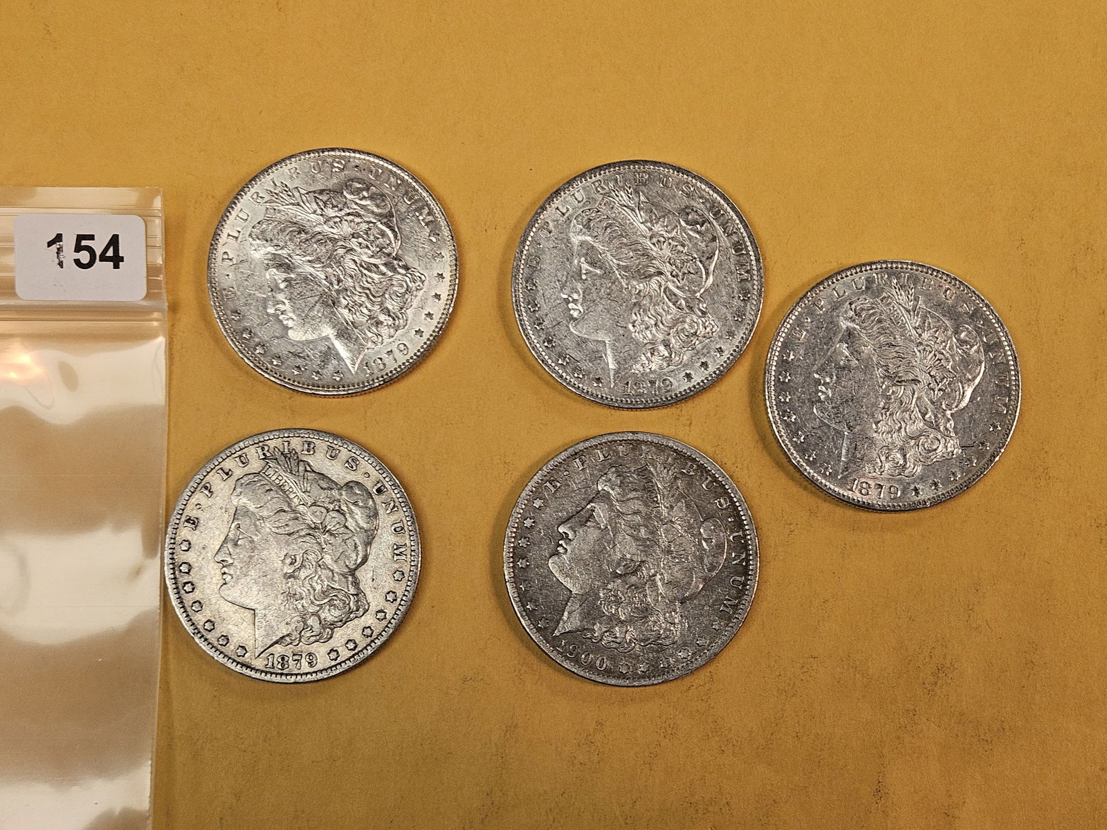 Five Mixed silver Morgan Dollars: Circulated 