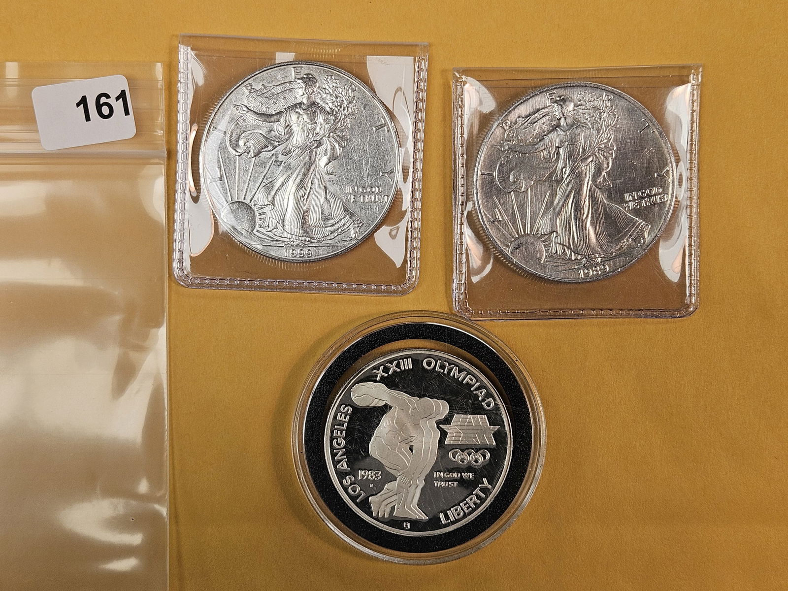 Three mixed silver Dollars: ASE and Commem. Mixed grades