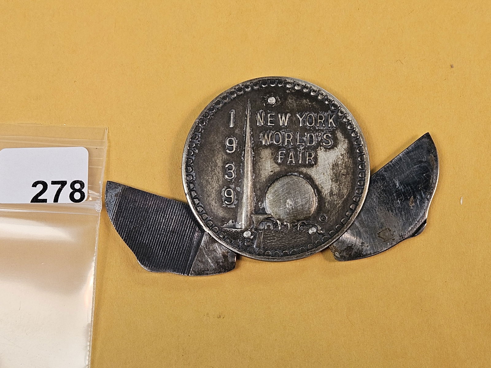 Super Cool 1939 New York World's Fair Souvenir silver medal-pocketknife: Shaped like a coin, but has a small blade and small file in it! 